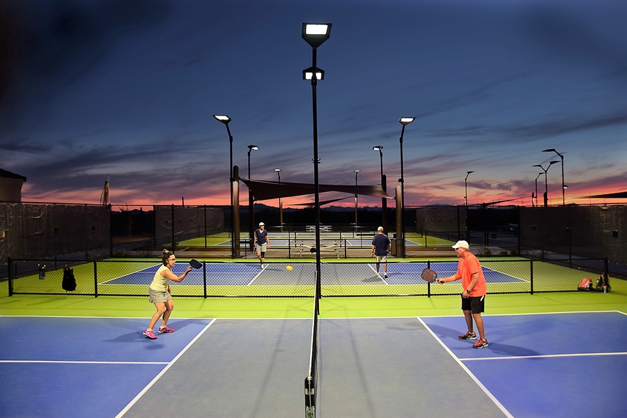 elderly people playing pickleball
